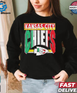 Taylor wearing Kansas City Chiefs Mexican style shirt