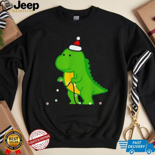 Dinosaur putting up string lights Christmas shirt