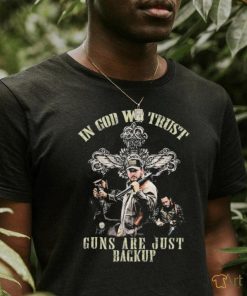 Cross and the man holding gun in god we trust guns are just backup shirt