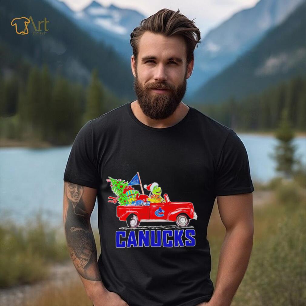 https://img.eyestees.com/teejeep/2023/Happy-Merry-Christmas-The-Grinch-drive-a-car-Vancouver-Canucks-ice-hockey-logo-flag-gift-shirt1.jpg