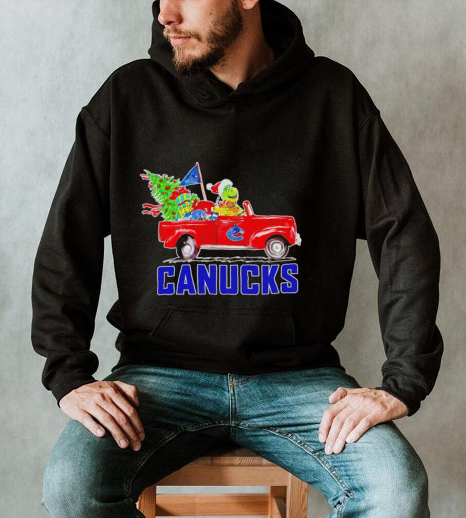 https://img.eyestees.com/teejeep/2023/Happy-Merry-Christmas-The-Grinch-drive-a-car-Vancouver-Canucks-ice-hockey-logo-flag-gift-shirt4.jpg