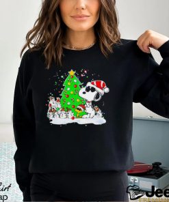 Snoopy and snowman next to the pine tree Christmas shirt