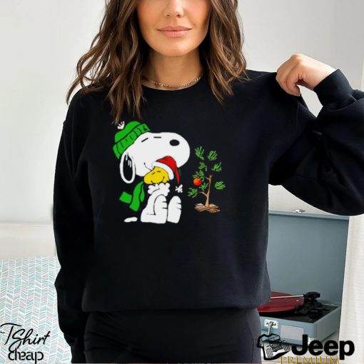 Snoopy hugs his Christmas day Woodstock shirt