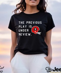 The previous play is under review helmet addict logo shirt