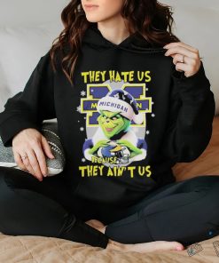 They Hate Us Because Ain’t Us The Grinch Hand Love Michigan Wolverines Christmas Shirt