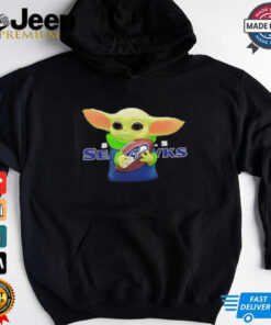 Baby Yoda holding Seattle Seahawks football shirt
