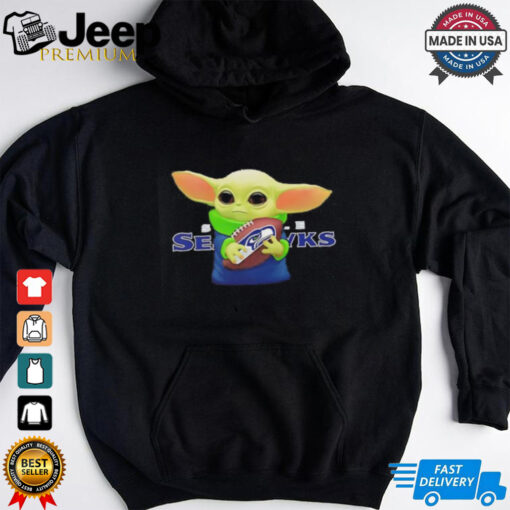 Baby Yoda holding Seattle Seahawks football shirt