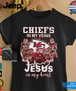 Chiefs in my veins Jesus in my heart shirt featuring bold text and a design blending football fandom with faith.