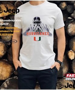 Football player garb Miami Hurricanes logo shirt