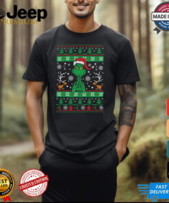 Grinch Santa Hat Ugly Christmas shirt featuring a festive design with the Grinch wearing a classic Santa hat. Perfect for adding a playful and mischievous touch to your holiday wardrobe.