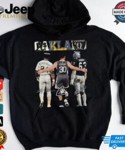 Oakland Athletics Henderson Raiders and Stephen Curry T-shirt featuring a unique crossover design that combines the logos and imagery of the Oakland Athletics, the Raiders, and Stephen Curry, creating a fun, sports-themed graphic that celebrates iconic figures from different teams in Oakland.