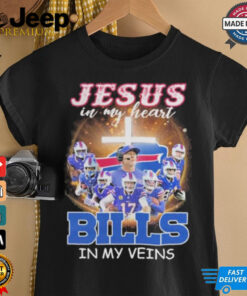 Official Jesus in My Heart Buffalo Bills Players in My Veins shirt featuring a bold design combining faith and football fandom with team graphics and inspirational text.