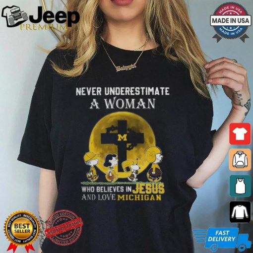 Peanuts Characters Never Underestimate A Woman Who Believes In Jesus And Loves Michigan Wolverines Shirt