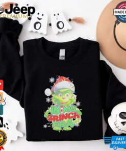 Santa hat in my Grinch era Christmas shirt
