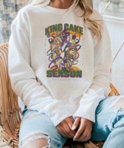 **King Cake Season: Any Way You Slice It Shirt** – Celebrate the festive spirit of Mardi Gras with this vibrant shirt! Featuring a playful design that captures the joy and tradition of King Cake season, this shirt is perfect for partygoers and dessert lovers alike. Show off your love for this iconic treat 